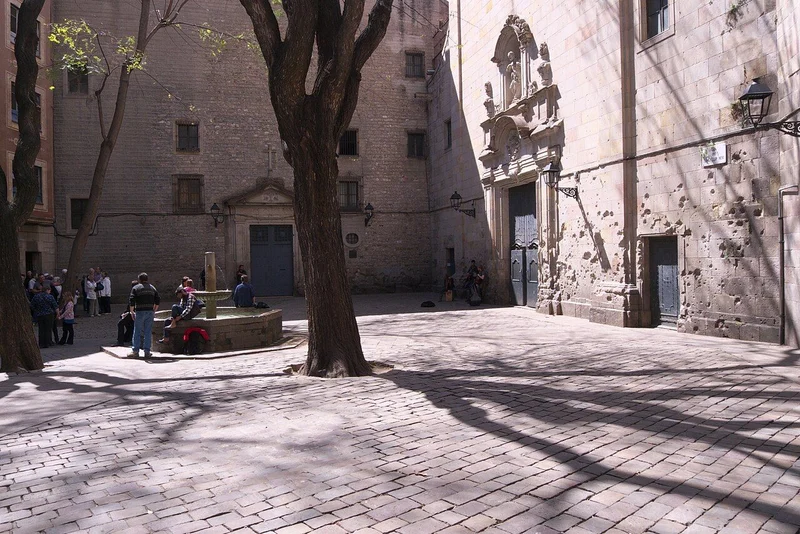 Sunlit Plaça de Sant Felip Neri in Barcelona’s Gothic Quarter