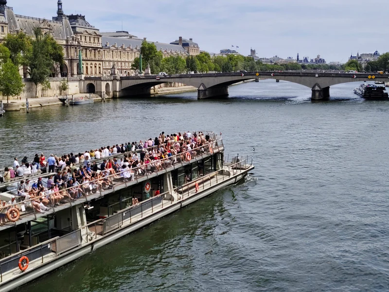 Sightseeing boat on the Seine, Paris; illustrative vessel, not the named operator’s boat