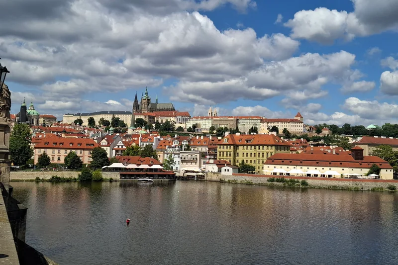 Prague Castle and Lesser Town above the Vltava, seen from Charles Bridge in daylight